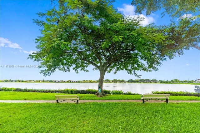 a view of field with grass and trees