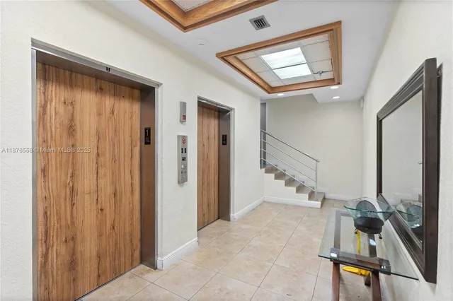 a view of an entryway with wooden floor