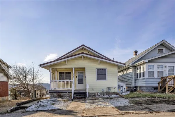 a front view of a house with yard