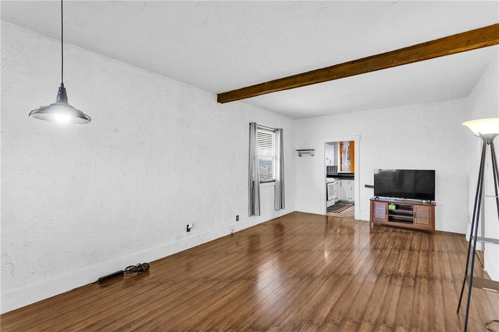 1909 Freeport Road New Kensington, PA 15068 - Photo 4 of 25 a view of empty room with wooden floor and fan