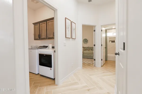 a view of a kitchen with an entryway and an empty room