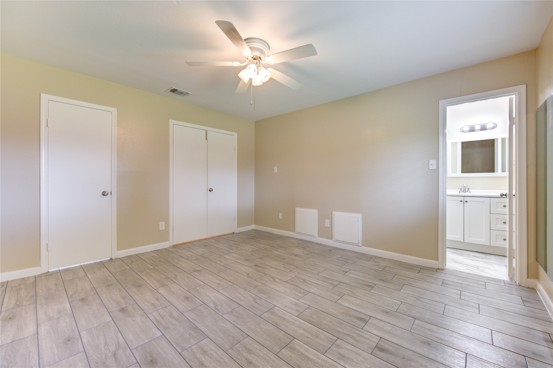 3702 Royal Manor Drive Houston, TX 77082 - Photo 12 of 18 a view of an empty room with wooden floor