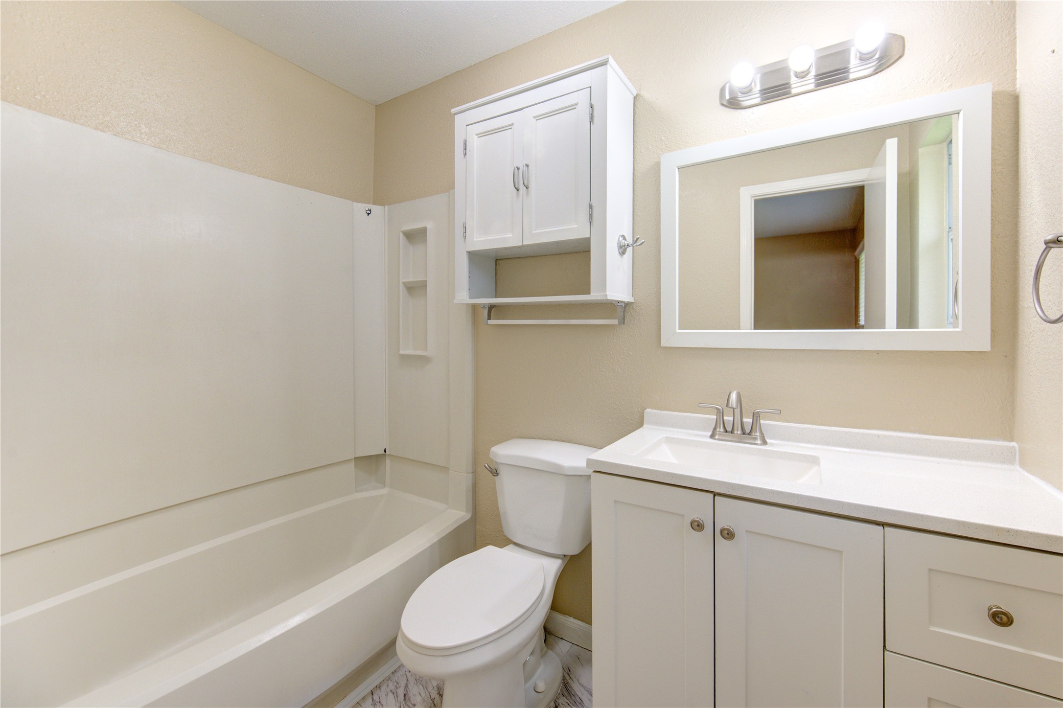 3702 Royal Manor Drive Houston, TX 77082 - Photo 13 of 18 a bathroom with a toilet a sink and a bathtub