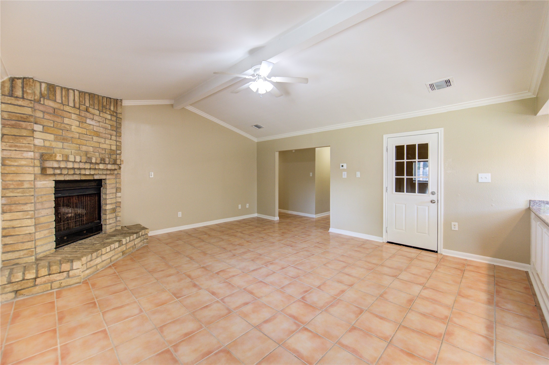 3702 Royal Manor Drive Houston, TX 77082 - Photo 3 of 18 a view of an empty room with chandelier fan and fire place