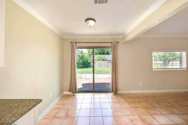 a view of an empty room and window