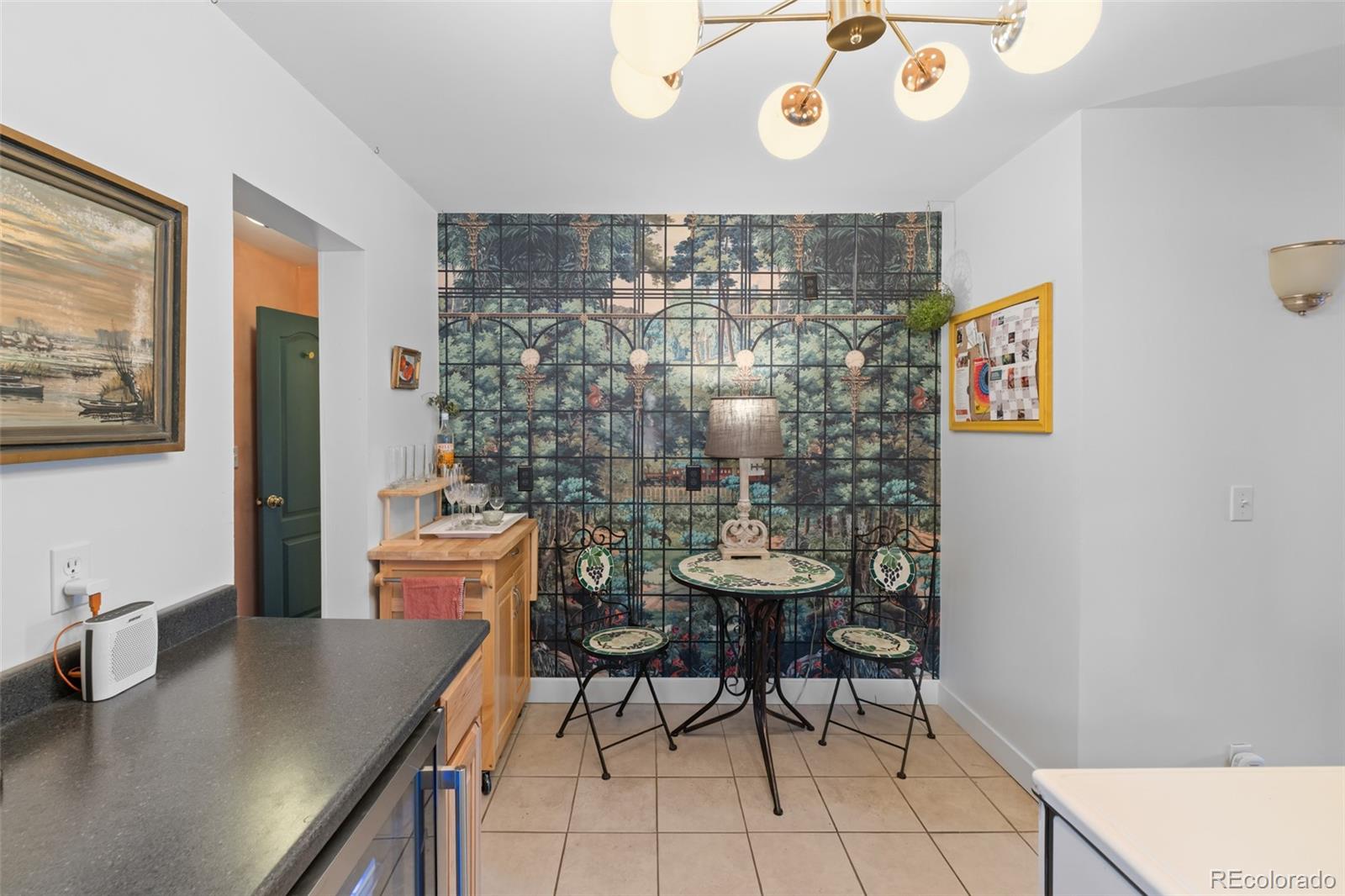 1047 Meade Street Denver, CO 80204 - Photo 17 of 38 a room with a table and chairs