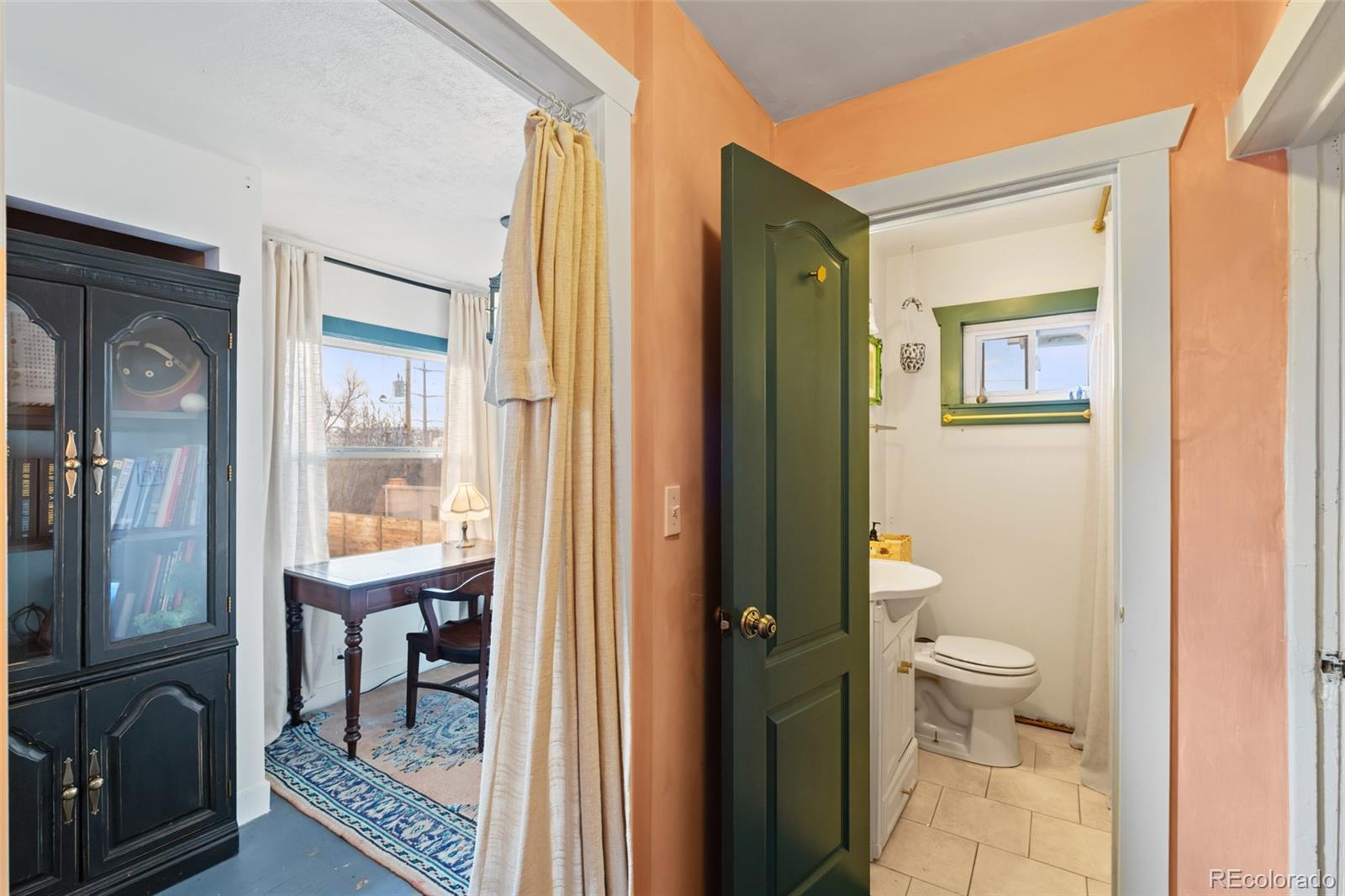1047 Meade Street Denver, CO 80204 - Photo 18 of 38 a view of a bathroom from a hallway