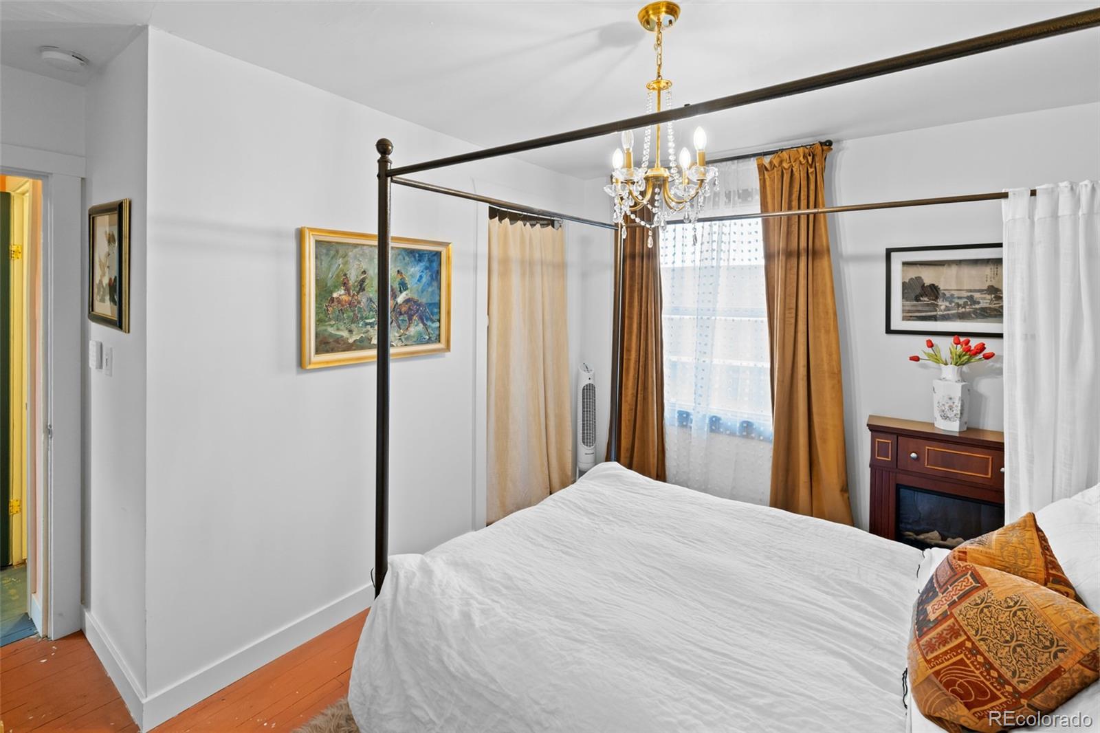 1047 Meade Street Denver, CO 80204 - Photo 21 of 38 a bedroom with a bed and a closet