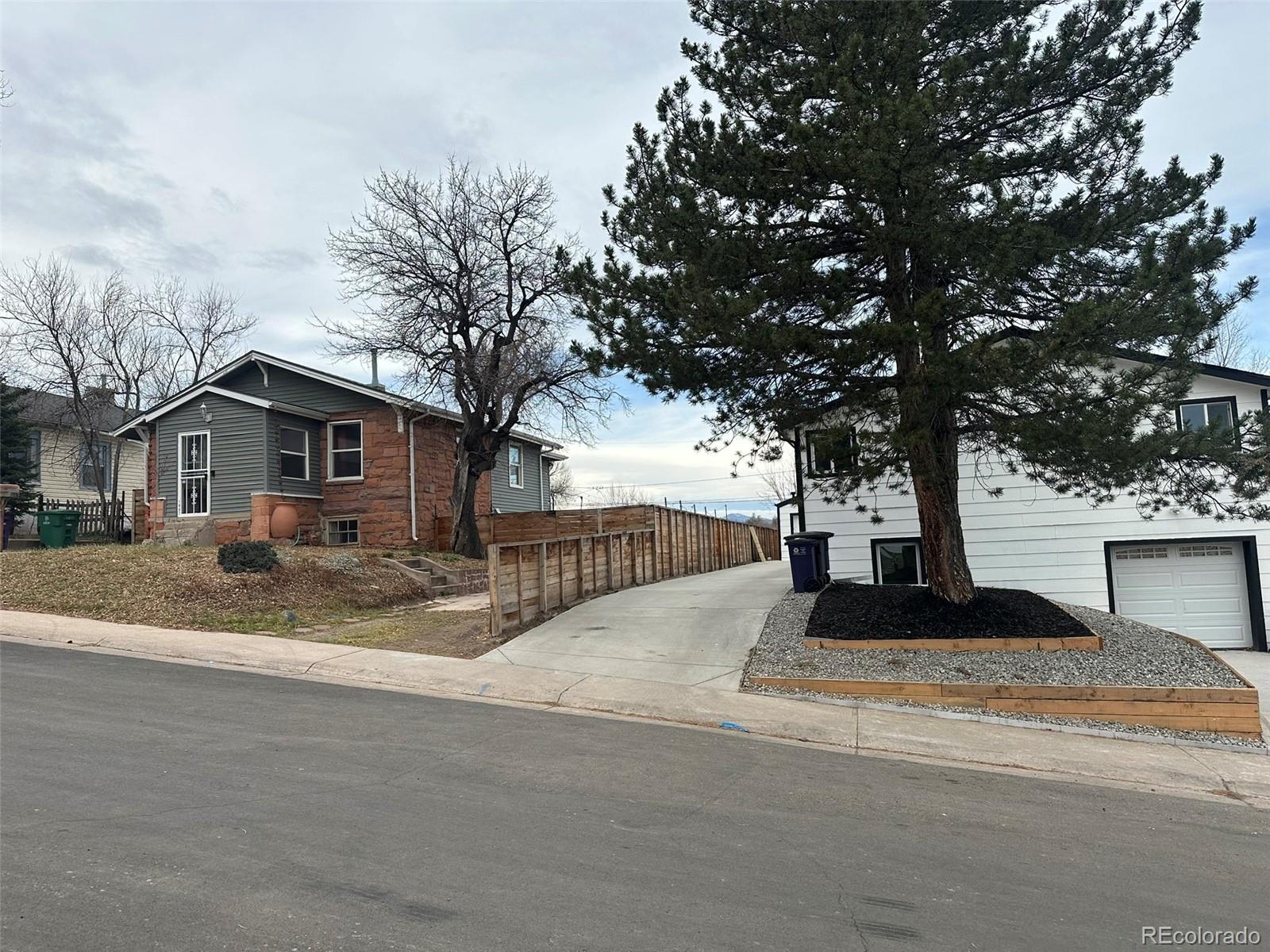1047 Meade Street Denver, CO 80204 - Photo 4 of 38 a view of house with backyard and tree