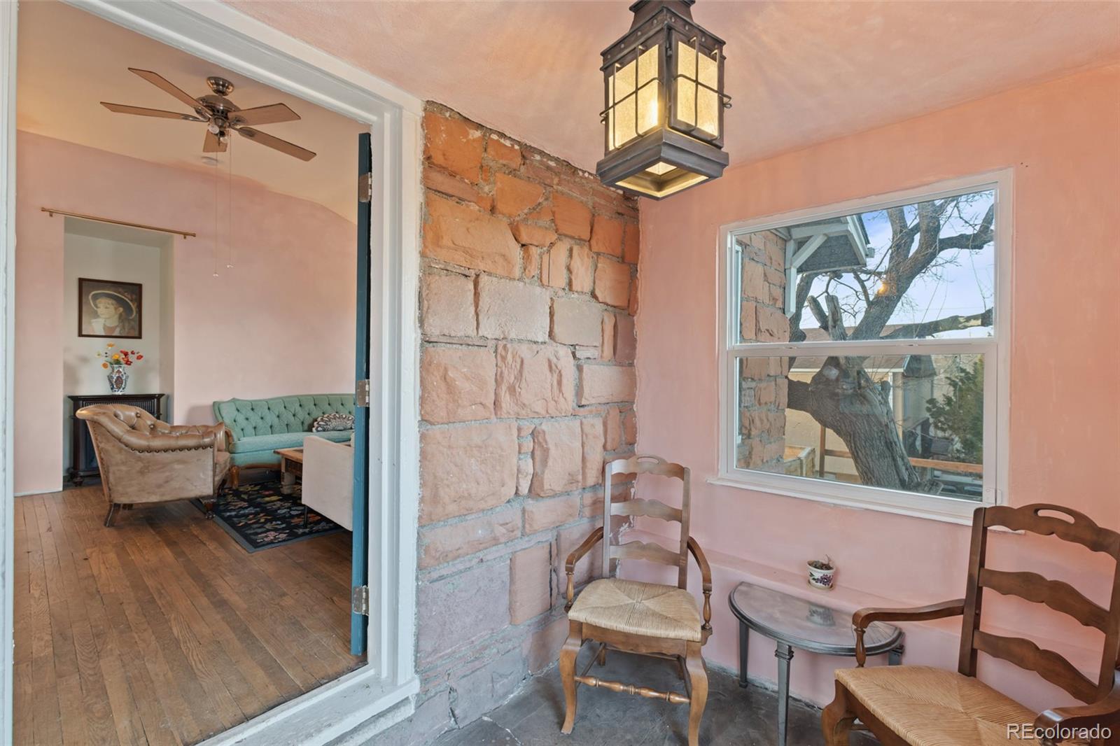 1047 Meade Street Denver, CO 80204 - Photo 6 of 38 a living room with furniture a rug and a window