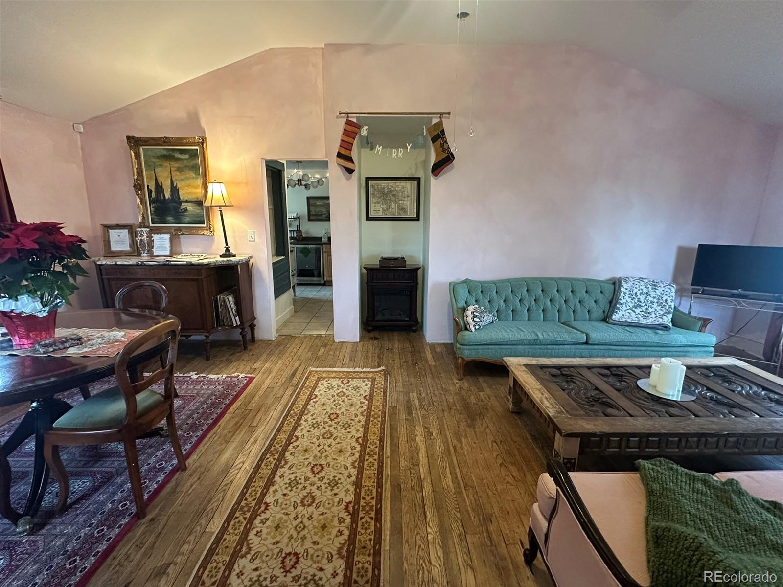 1047 Meade Street Denver, CO 80204 - Photo 7 of 38 a living room with furniture rug and wooden floor