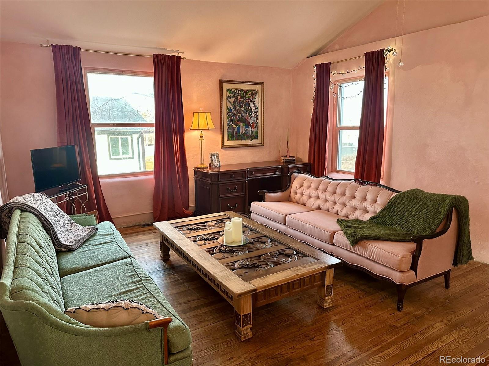 1047 Meade Street Denver, CO 80204 - Photo 9 of 38 a living room with furniture and a window
