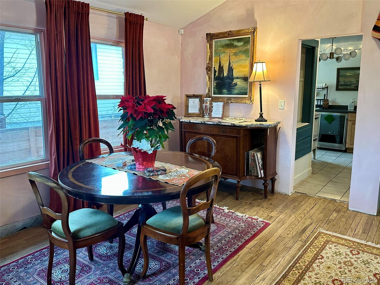 1047 Meade Street Denver, CO 80204 - Photo 10 of 38 a view of a dining room with furniture and window