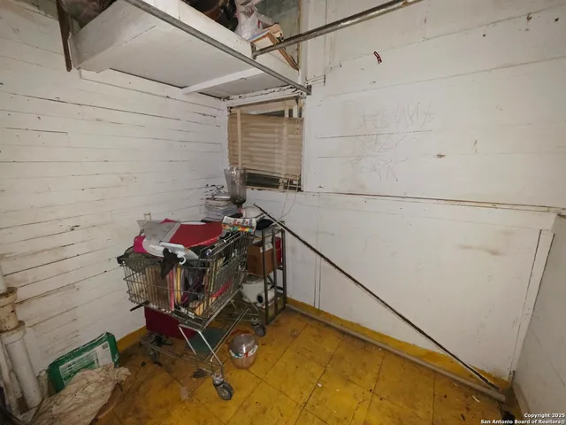 a view of a backyard with plants and a patio