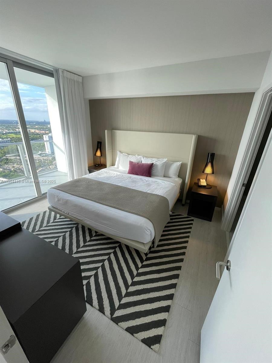 4010 South Ocean Drive, Unit R3306 Hollywood, FL 33019 - Photo 2 of 7 a bedroom with furniture and a window