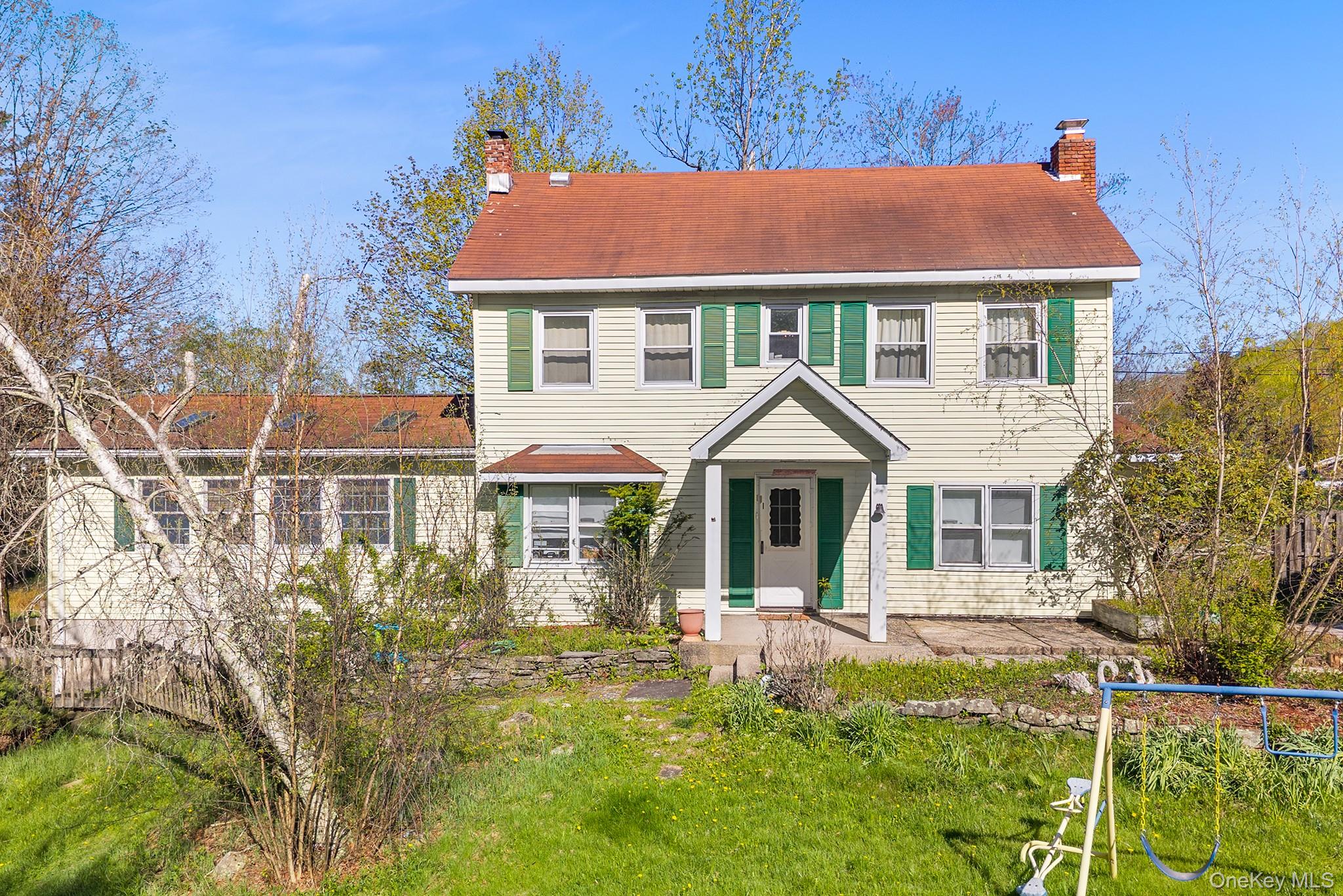 43 Taylor Road Parksville, NY 12768 - Photo 1 of 29 Two-story residence featuring siding exterior, an inviting covered front porch, and a red-toned roof