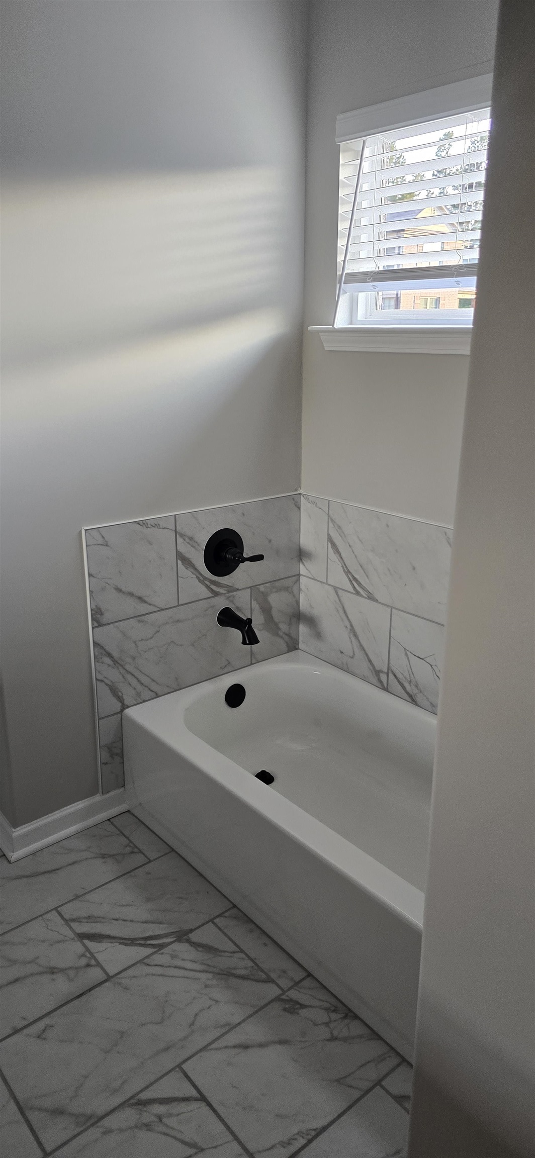 10148 Sterling Ridge Drive Cordova, TN 38018 - Photo 12 of 39 a bathroom with a sink and a bathtub