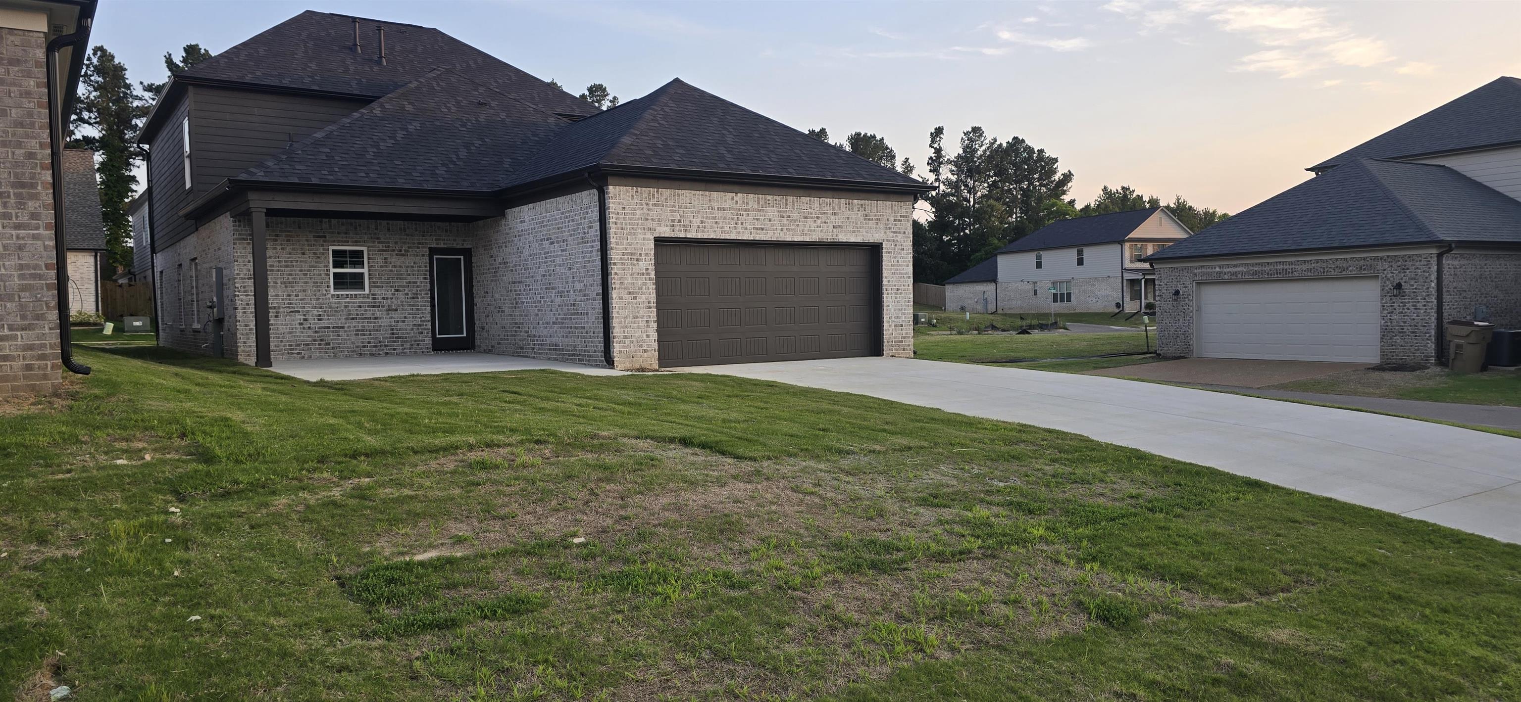 10148 Sterling Ridge Drive Cordova, TN 38018 - Photo 2 of 39 a view of a house with a yard and garage