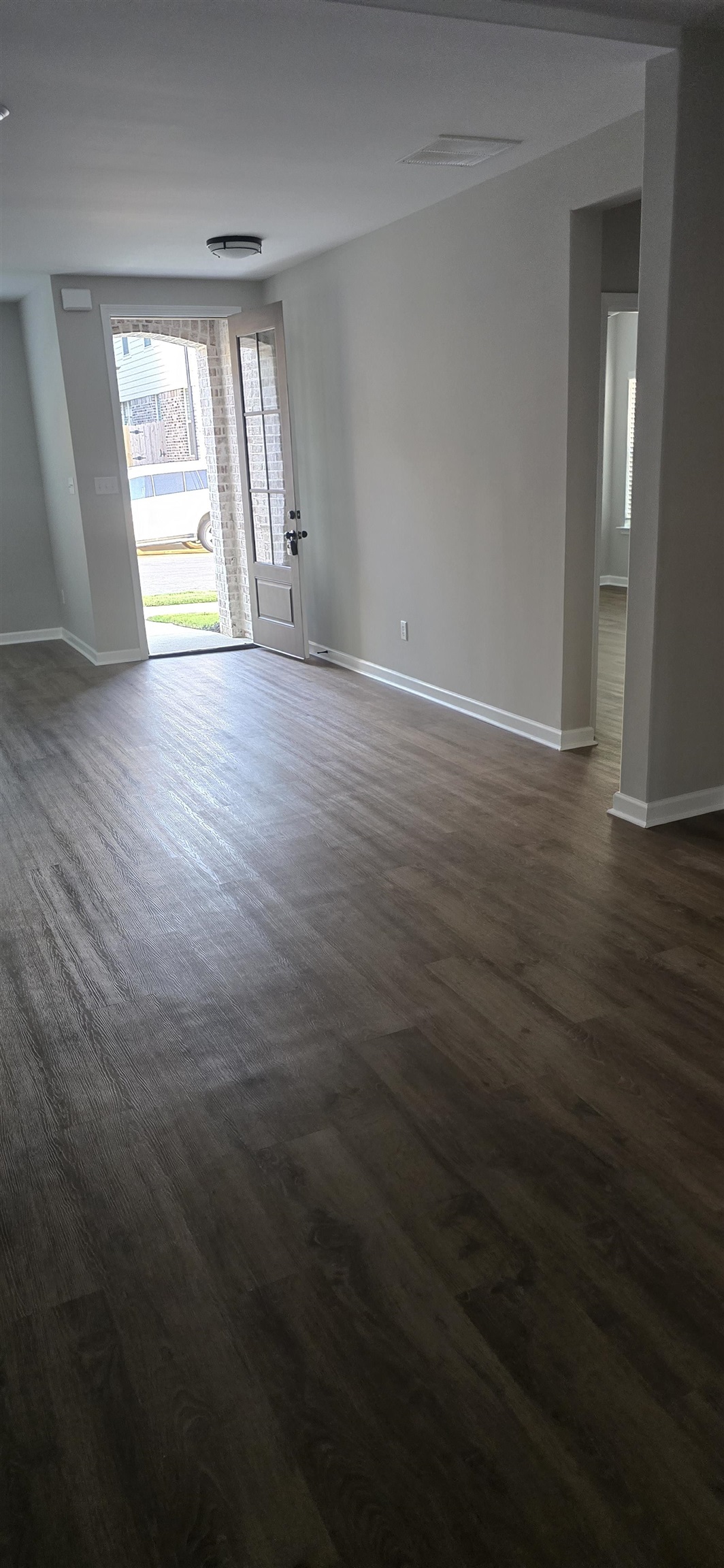 10148 Sterling Ridge Drive Cordova, TN 38018 - Photo 21 of 39 an empty room with wooden floor and windows