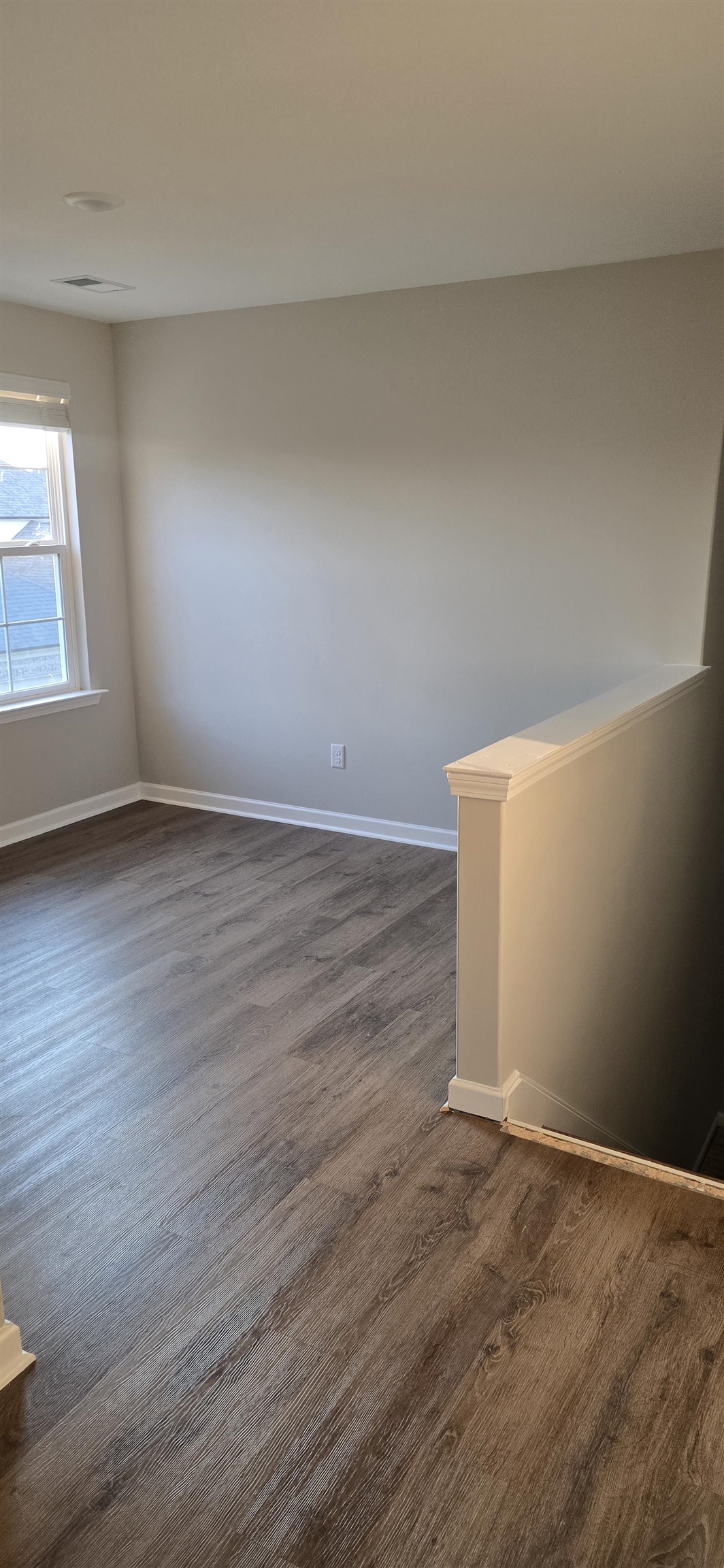 10148 Sterling Ridge Drive Cordova, TN 38018 - Photo 34 of 39 a view of an empty room with wooden floor and a window