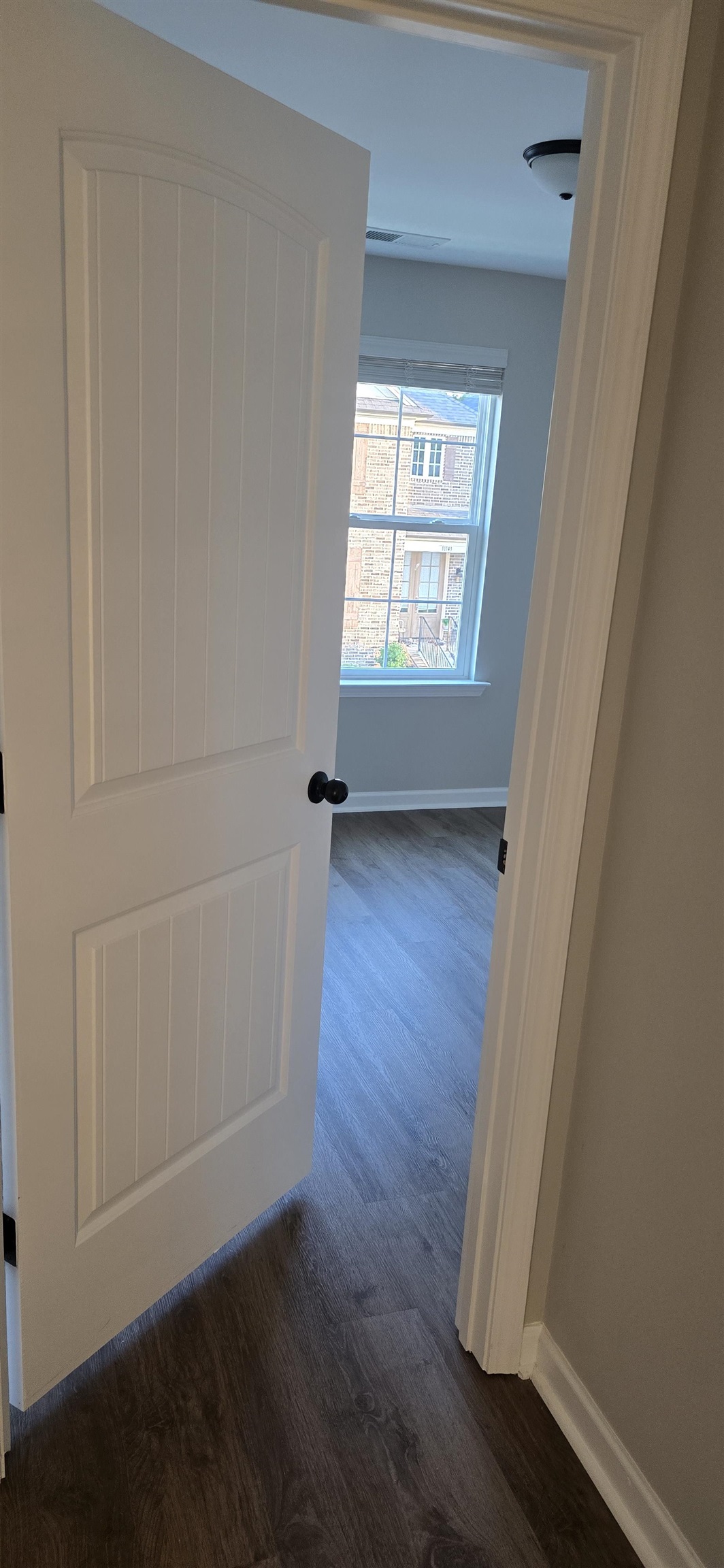 10148 Sterling Ridge Drive Cordova, TN 38018 - Photo 36 of 39 an empty room with wooden floor and windows