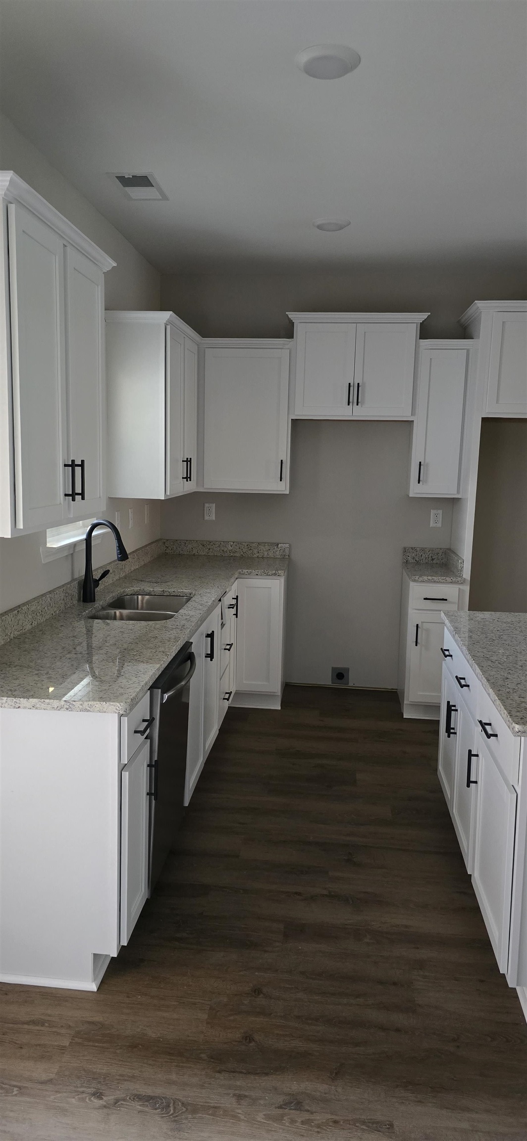 10148 Sterling Ridge Drive Cordova, TN 38018 - Photo 37 of 39 a kitchen with stainless steel appliances granite countertop a stove a sink and white cabinets