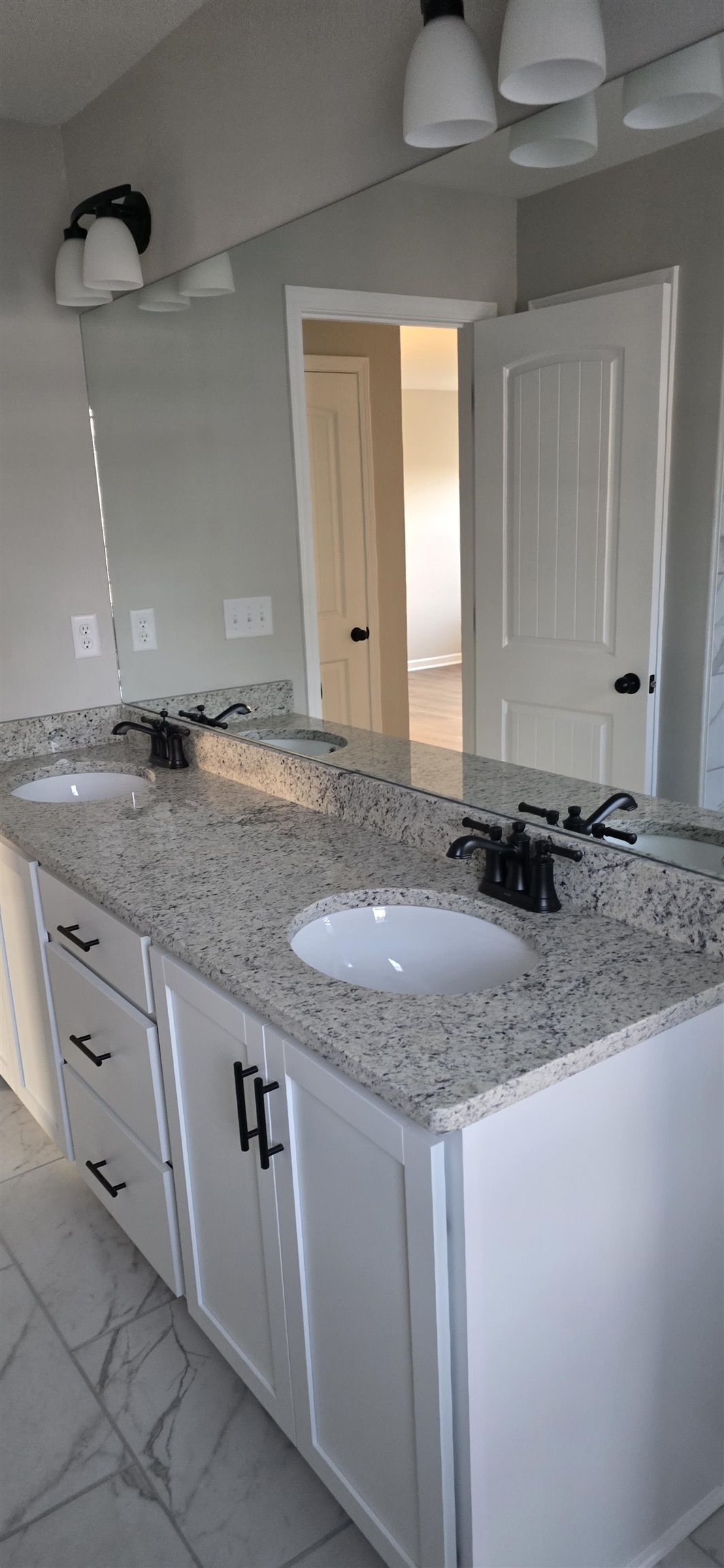 10148 Sterling Ridge Drive Cordova, TN 38018 - Photo 6 of 39 a bathroom with a granite countertop sink and a mirror