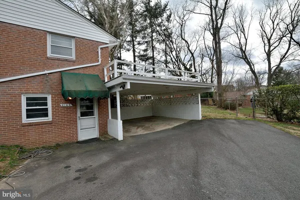 a view of a house with a garage and balcony