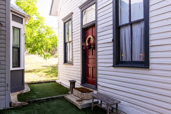 a view of a house with a door and a window