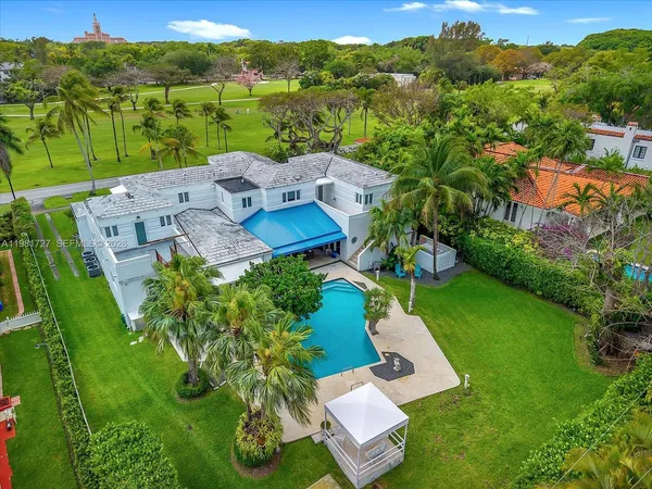 an aerial view of a house with mountain view