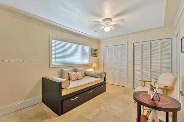a kitchen with a sink cabinets and window