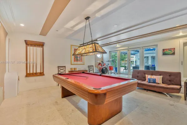 a bathroom with shower a sink and a mirror
