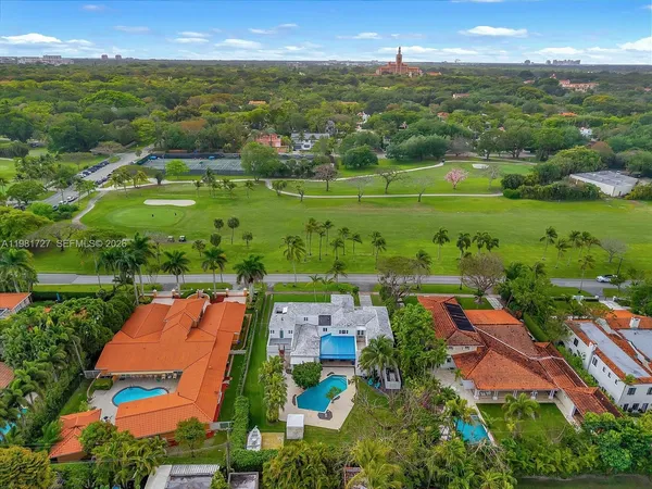 a bedroom with furniture and wooden floor