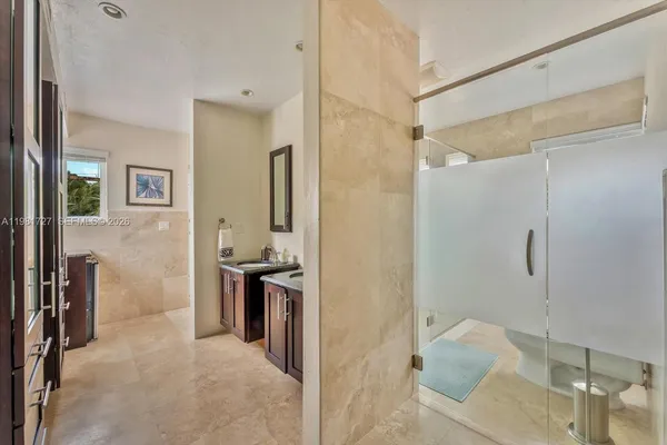 a bathroom with a sink toilet and shower