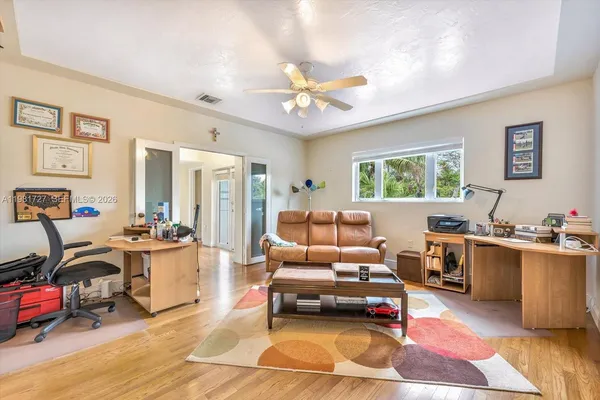 a view of a patio with couches and pool