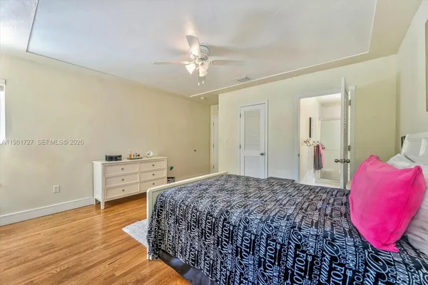 an aerial view of residential houses with outdoor space and river