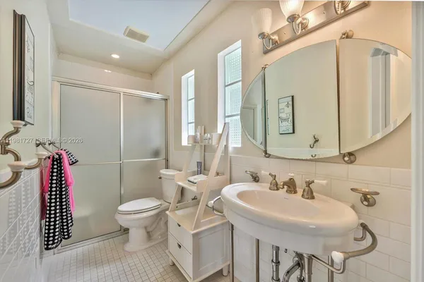 an aerial view of a houses with a yard