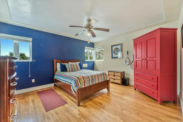 an aerial view of a house with a garden and swimming pool