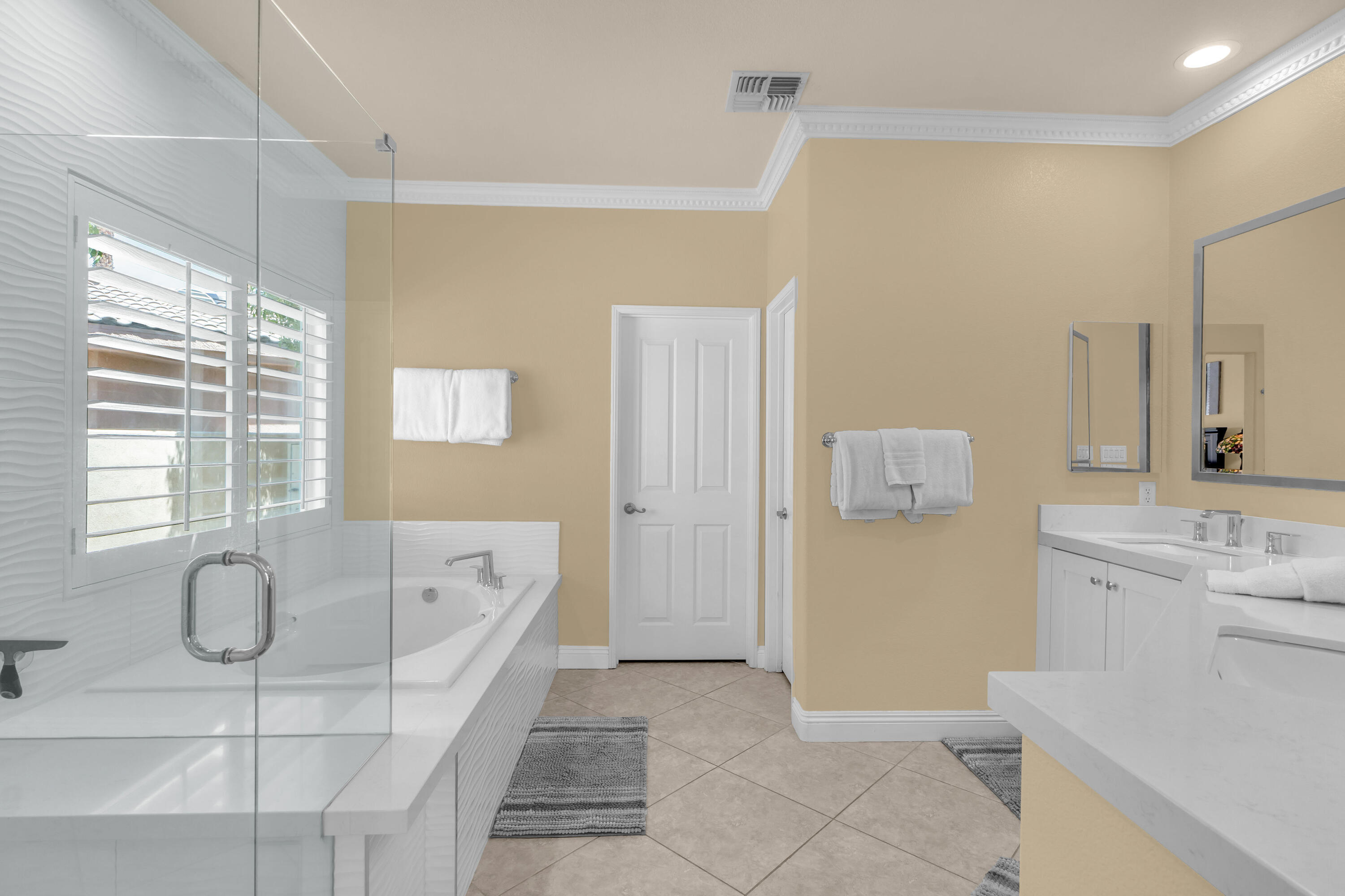 47845 Vía Opera La Quinta, CA 92253 - Photo 16 of 47 a spacious bathroom with a tub sink and mirror