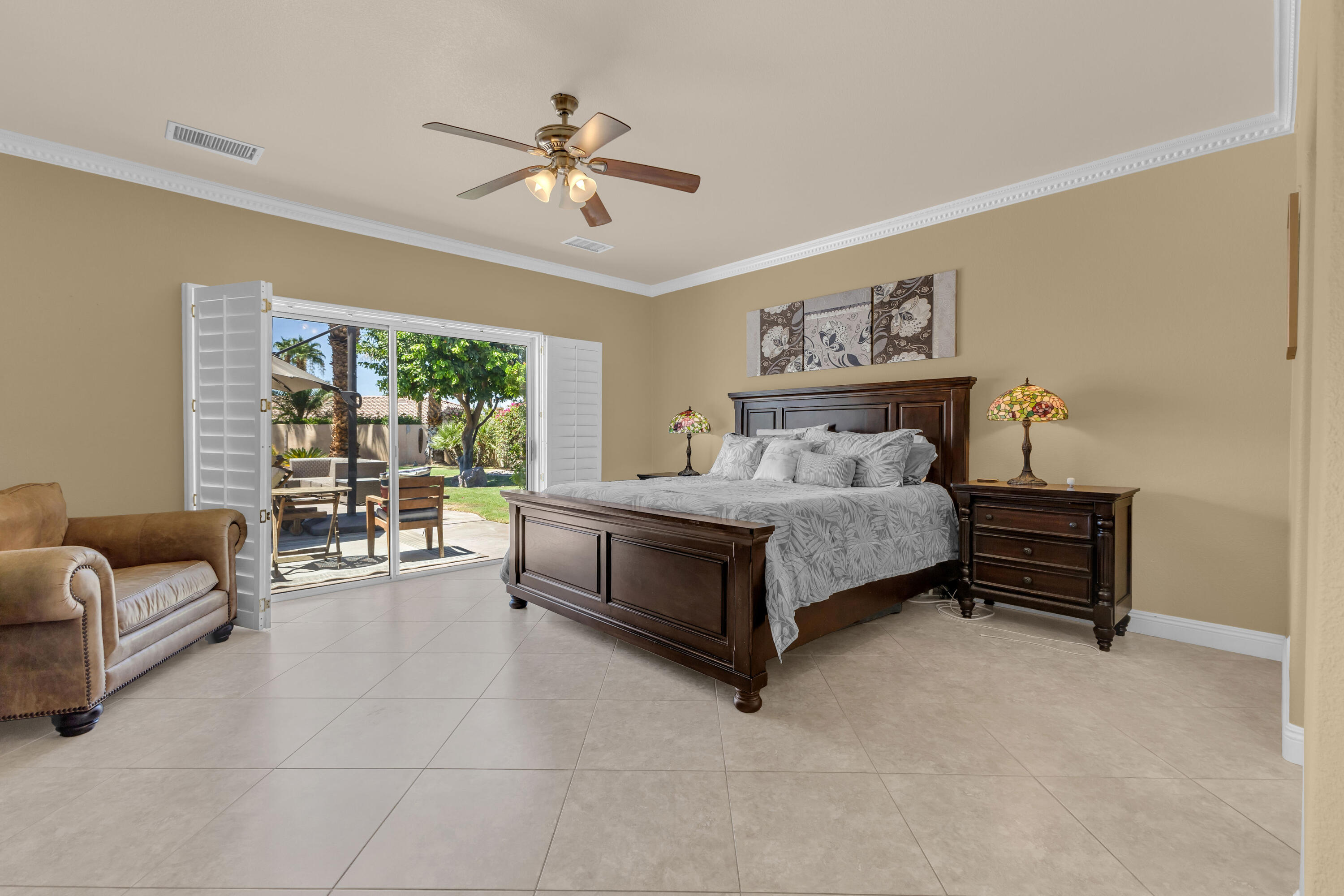 47845 Vía Opera La Quinta, CA 92253 - Photo 19 of 47 a spacious bedroom with a bed and a couch