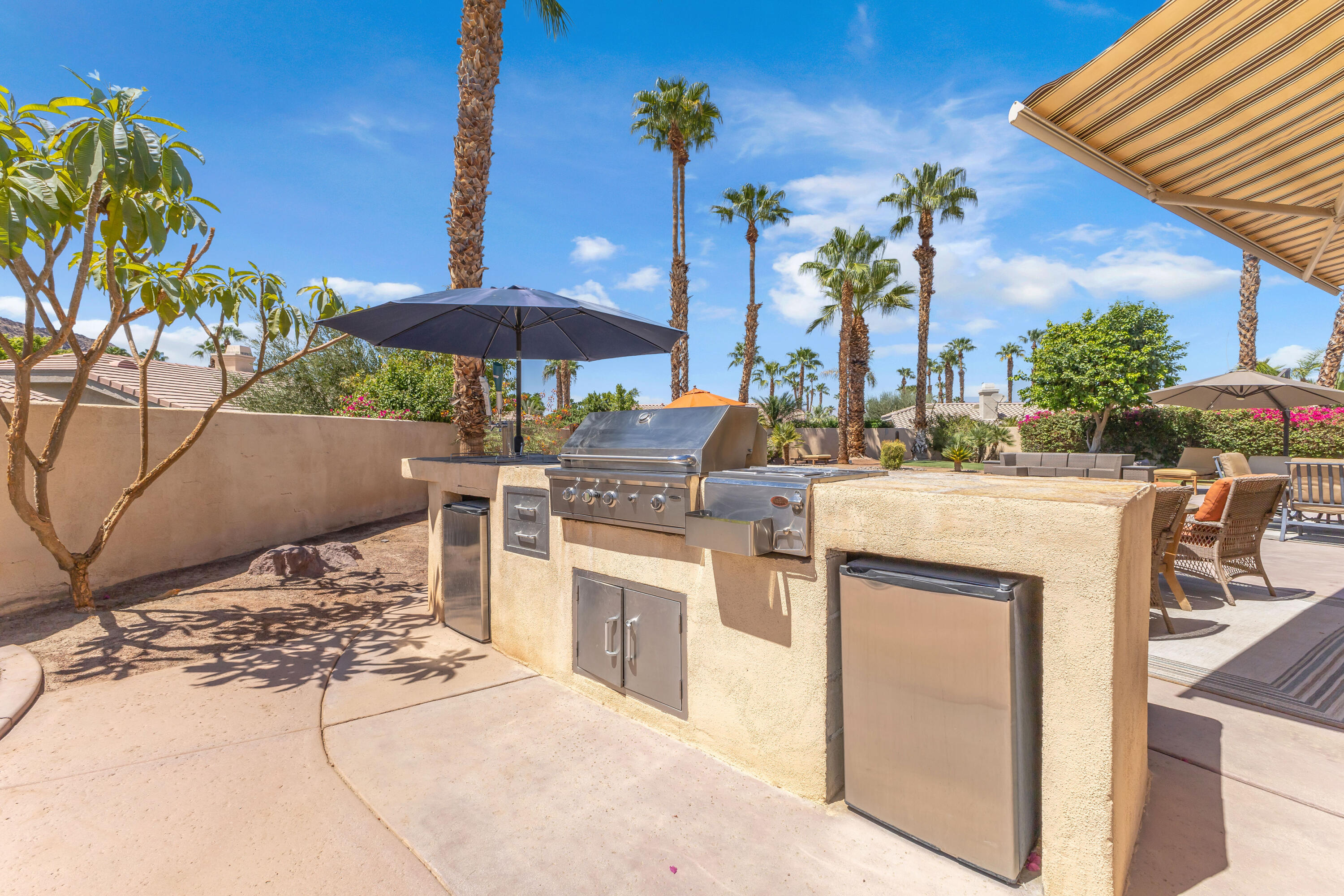 47845 Vía Opera La Quinta, CA 92253 - Photo 27 of 47 a building outdoor space with patio furniture