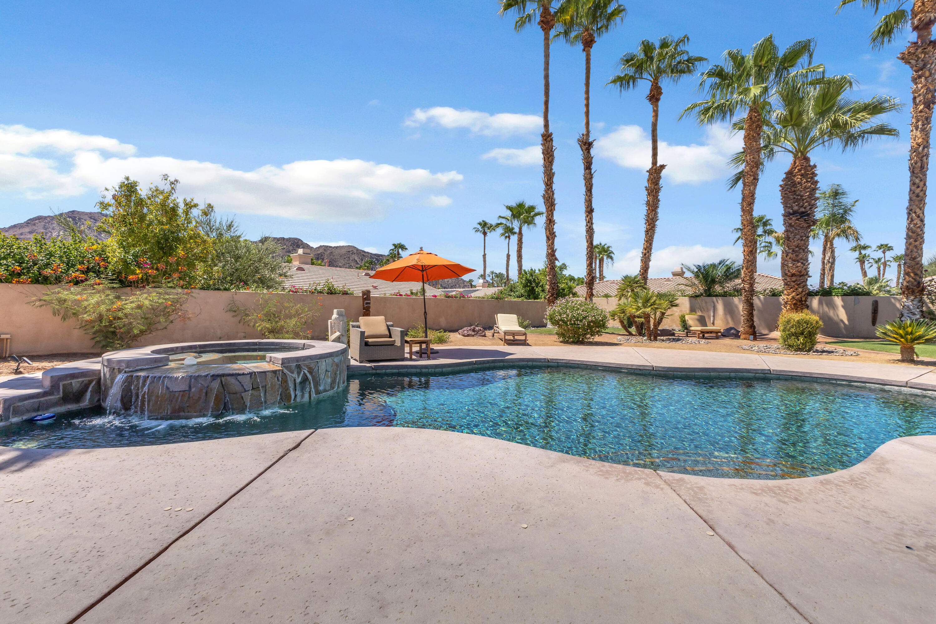 47845 Vía Opera La Quinta, CA 92253 - Photo 44 of 47 a view of swimming pool with outdoor seating and plants