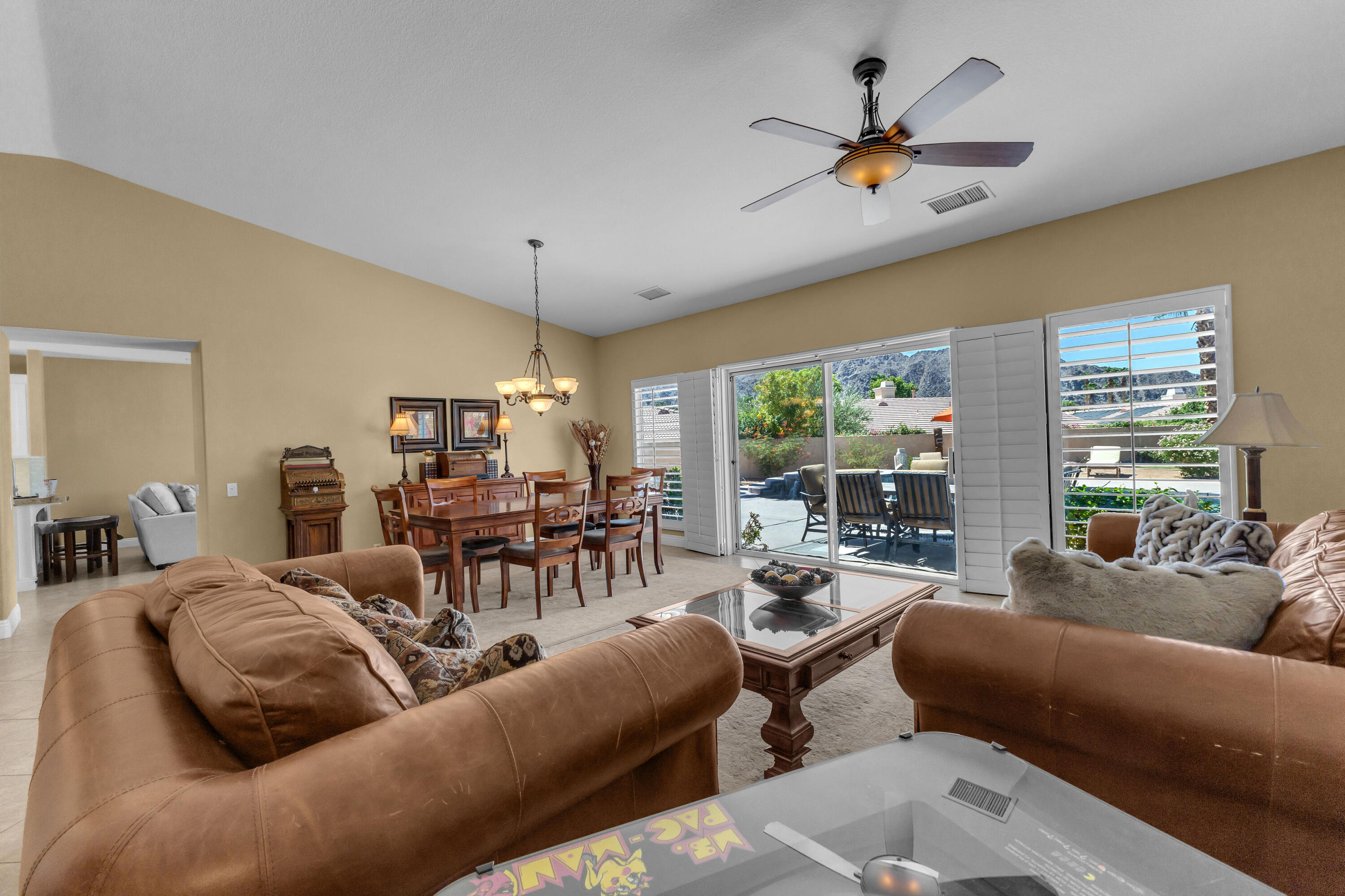 47845 Vía Opera La Quinta, CA 92253 - Photo 6 of 47 a living room with furniture ceiling fan and a large window