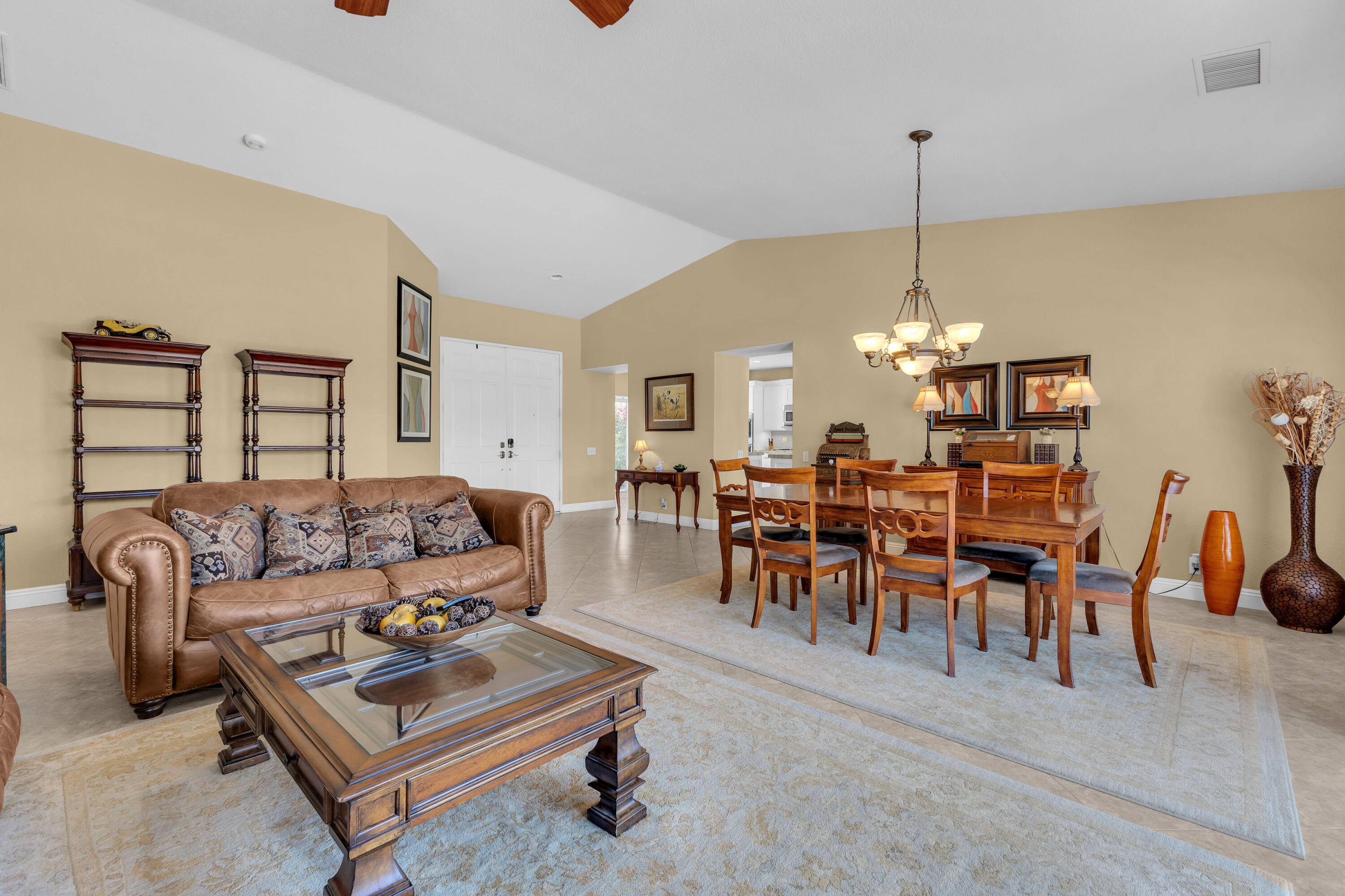 47845 Vía Opera La Quinta, CA 92253 - Photo 7 of 47 a living room with furniture kitchen view and a chandelier