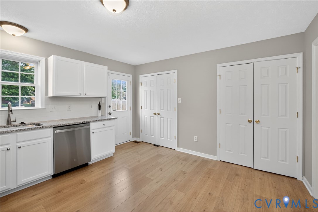 1827 Clarkson Road Richmond, VA 23224 - Photo 13 of 24 a kitchen with granite countertop a sink cabinets and wooden floor