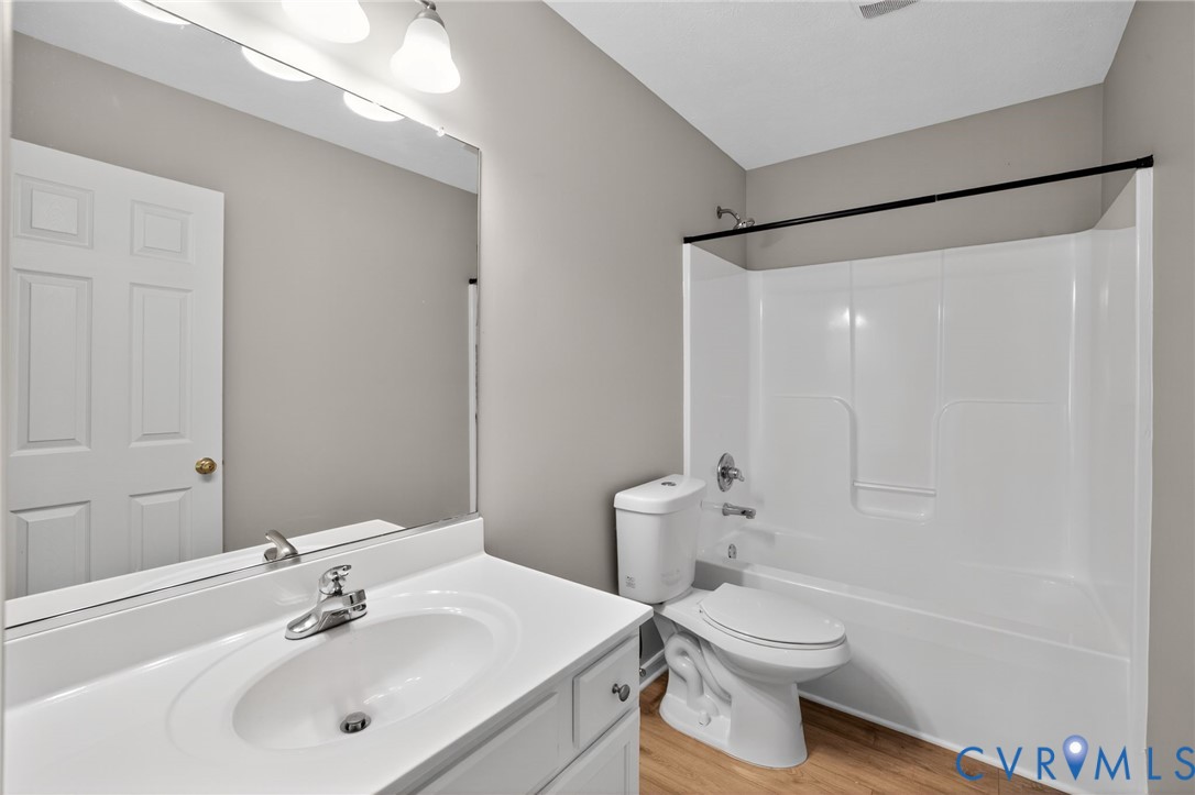 1827 Clarkson Road Richmond, VA 23224 - Photo 16 of 24 a bathroom with a sink toilet and shower