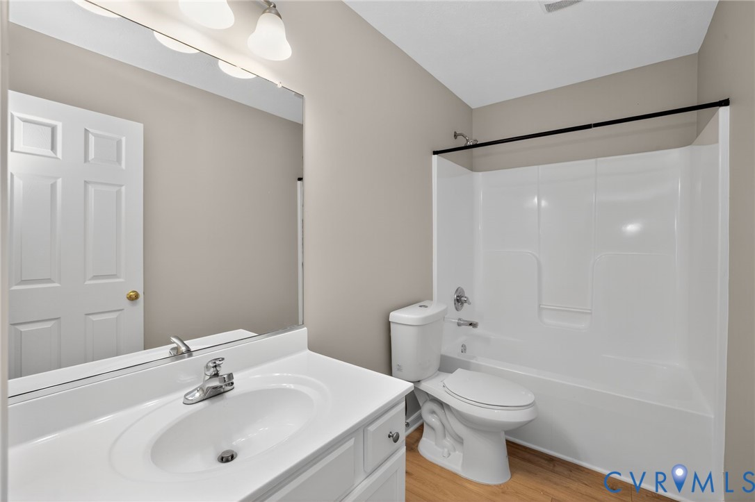 1827 Clarkson Road Richmond, VA 23224 - Photo 17 of 24 a bathroom with a sink toilet and shower