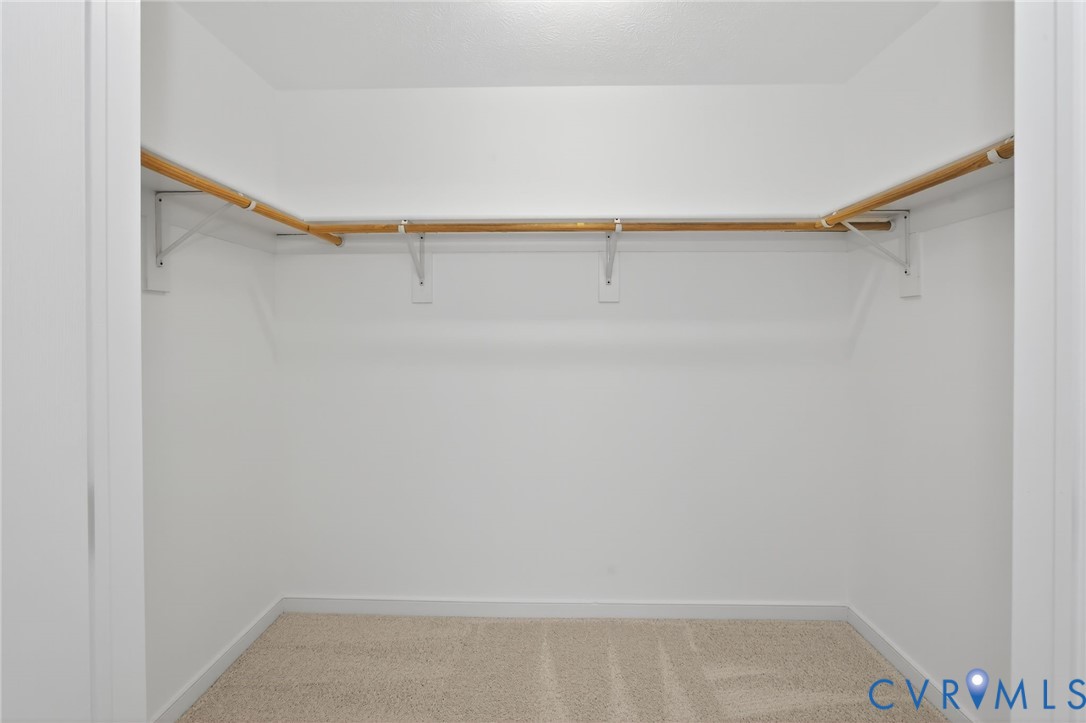 1827 Clarkson Road Richmond, VA 23224 - Photo 18 of 24 a view of walk in closet with empty racks