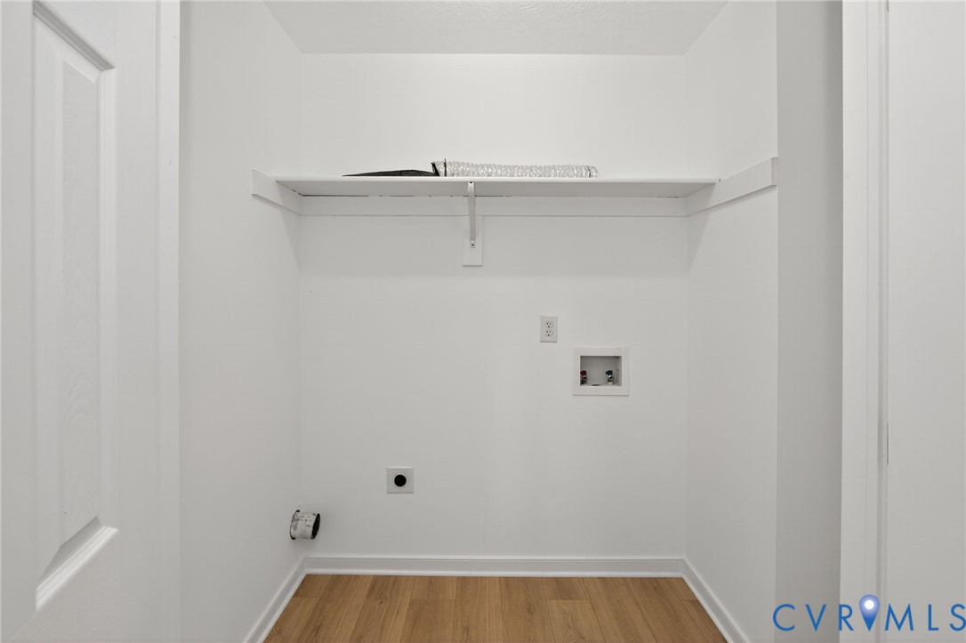 1827 Clarkson Road Richmond, VA 23224 - Photo 19 of 24 a view of a room with racks on the wall