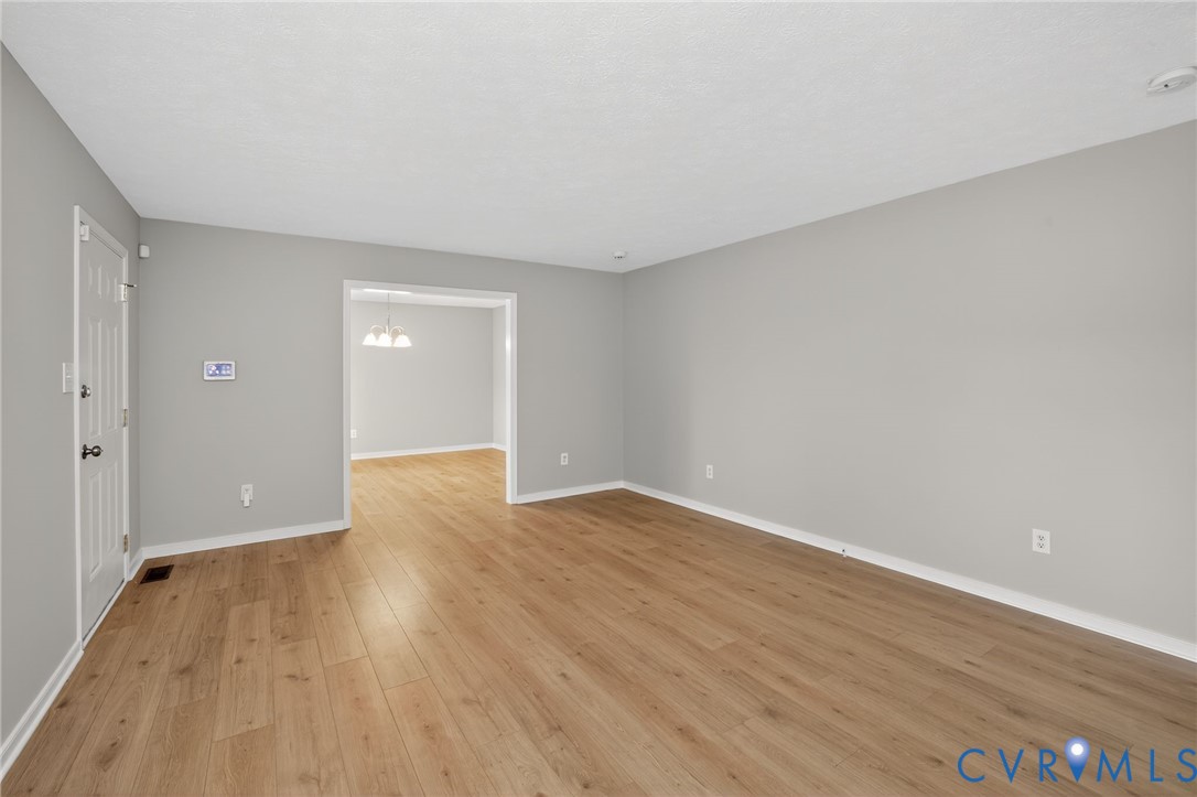1827 Clarkson Road Richmond, VA 23224 - Photo 20 of 24 a view of an empty room and wooden floor